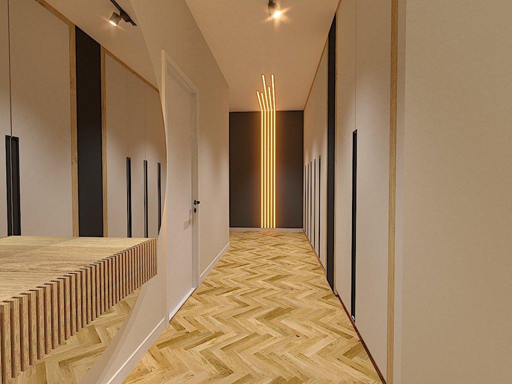 Projekt holu w zaprojektowanym domu w stylu nowoczesnym w Gomunicach widok na aranżacje holu z zabudową szaf, ledami, lustrem i konsolą