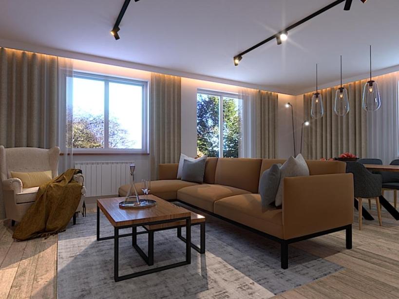 Salon 29m2, strefa wypoczynkowa, sofa w kolorze miodowym na nóżkach, stolik kawowy drewniany, duży szary dywan, poduszki dekoracyjne w kolorze szary, biały